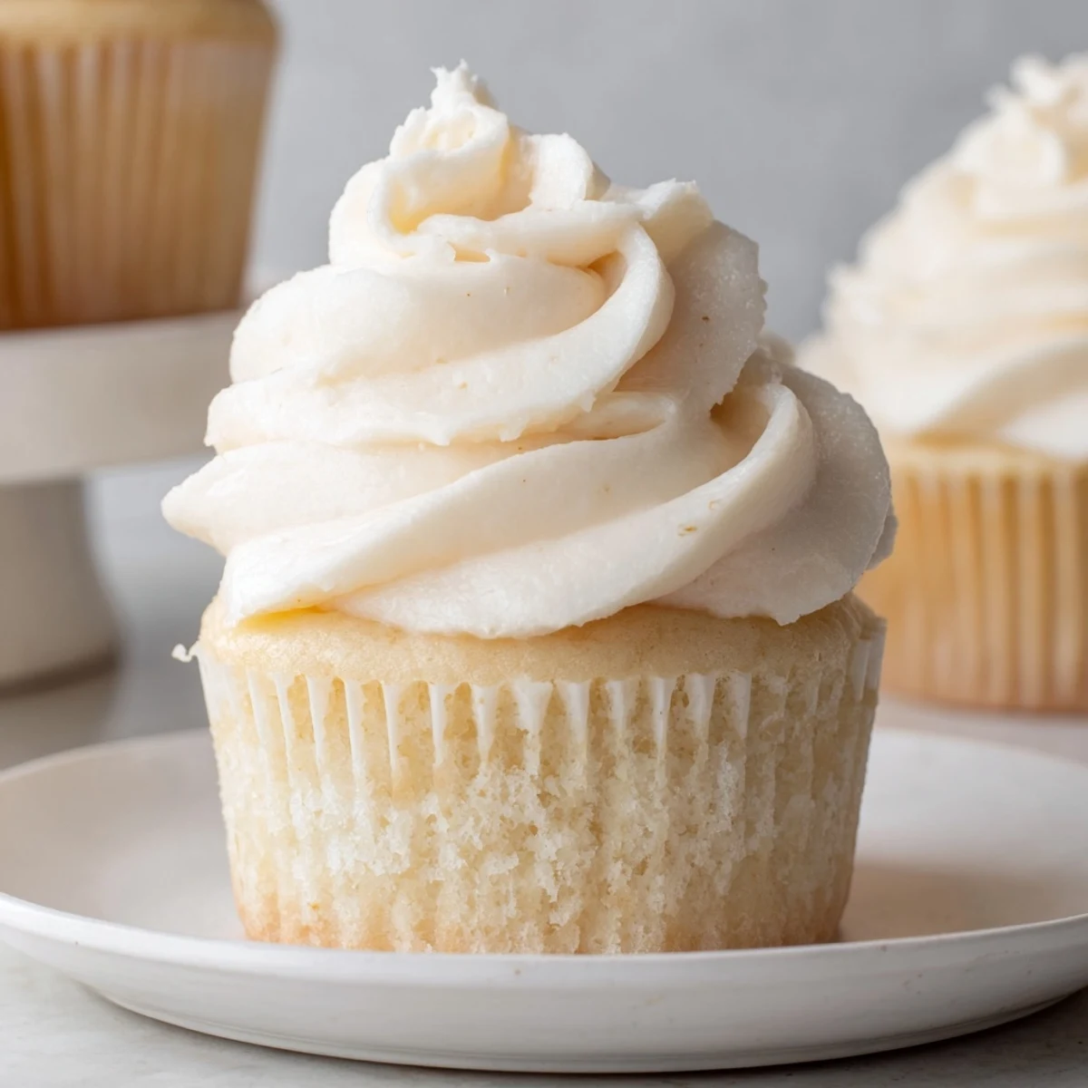 Fluffy vanilla cupcakes, frosted generously with sweet buttercream, perfect for a special occasion.