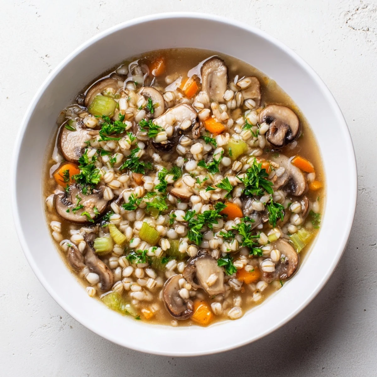 Hearty and flavorful Wild Mushroom and Barley Soup, a rustic and cozy, one-pot meal.