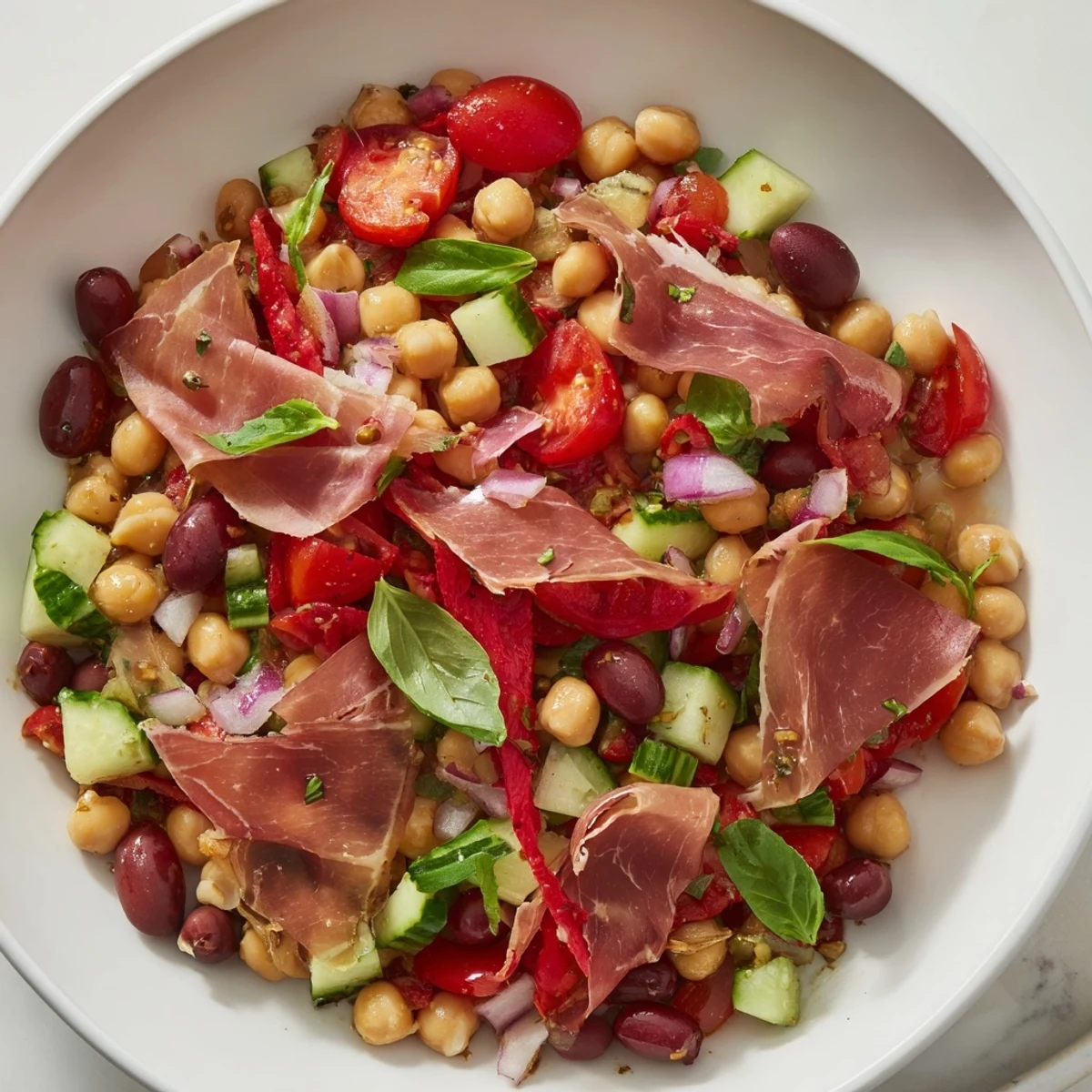 Tender, colorful Dense Bean Salad with Prosciutto showcases a delightful mix of textures and flavors.