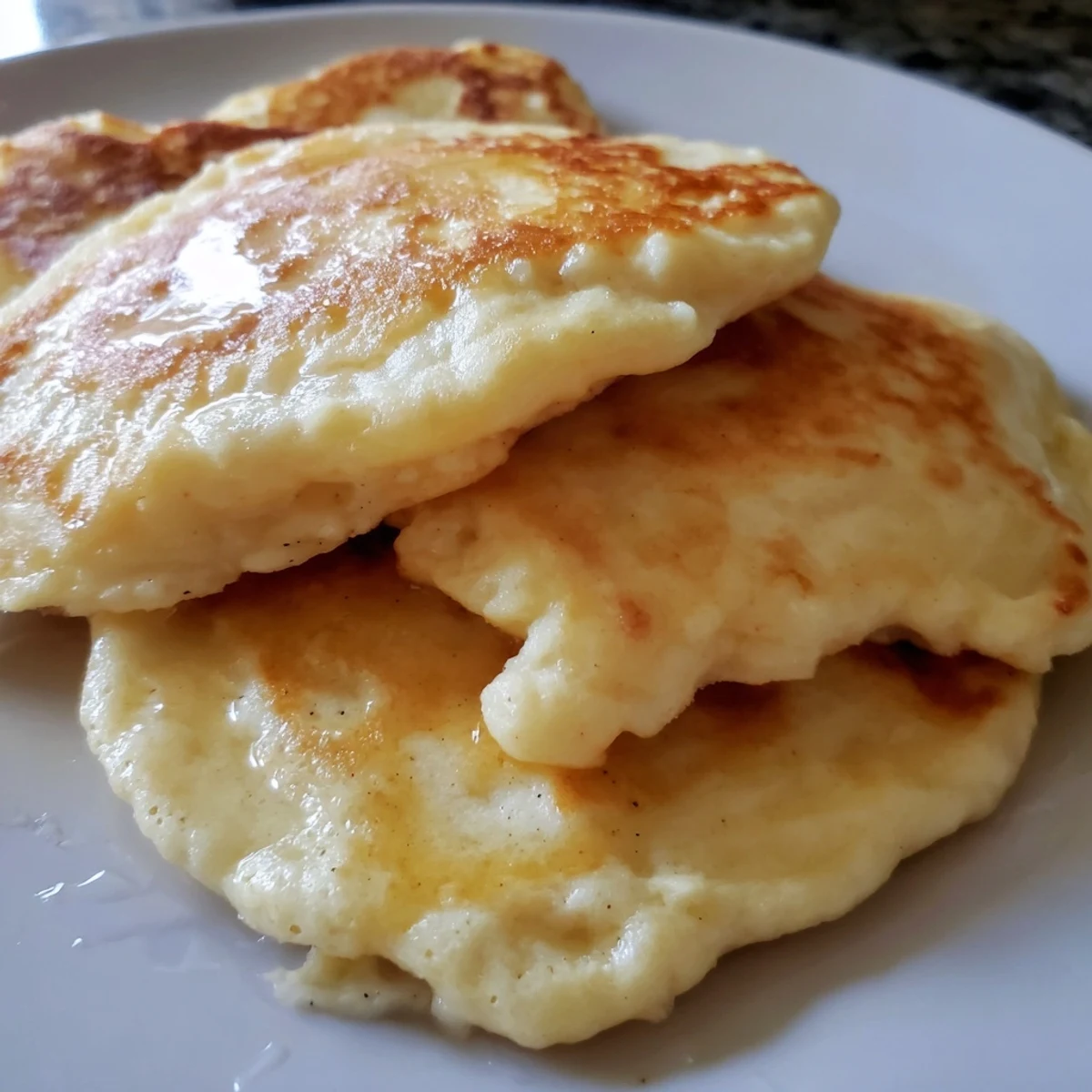 Indulge in these light and airy fluffy scrambled pancakes, perfect with fresh fruit and syrup for breakfast.