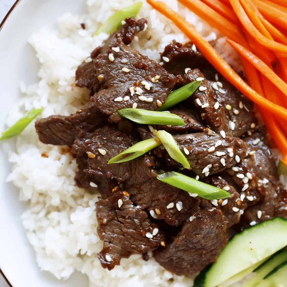 A tempting close-up of a Bulgogi Beef Bowl showcasing savory marinated beef with vibrant toppings and sesame seeds.