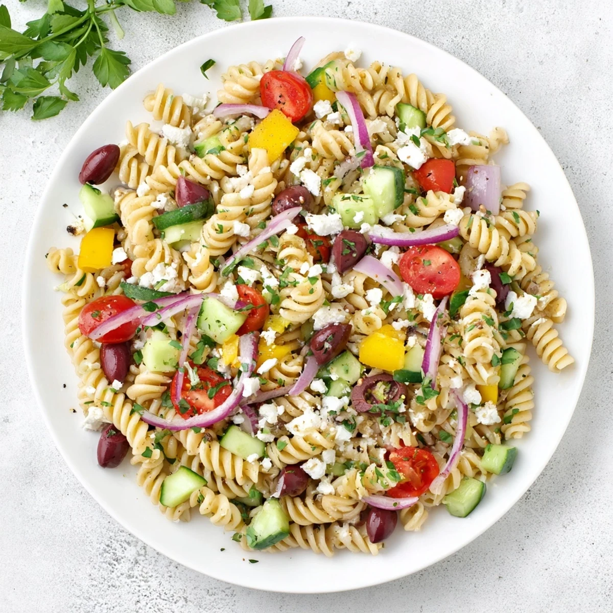 Perfect summer serving of Lemon Pasta Salad, tossed in a tangy dressing, ready to enjoy.