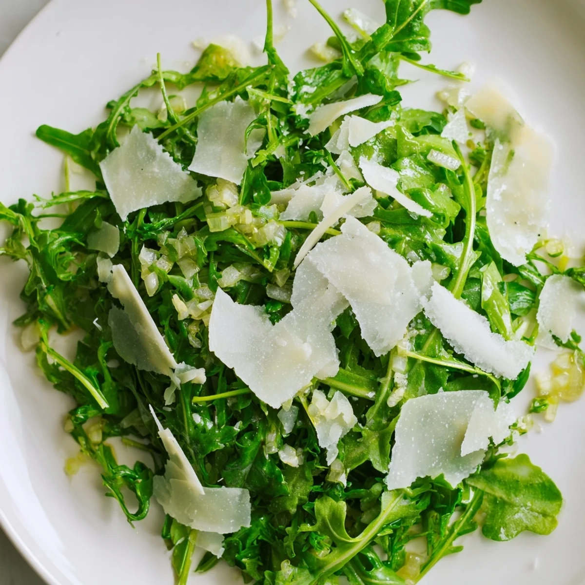 Close-up of a vibrant Arugula salad drizzled with delicious lemon vinaigrette.