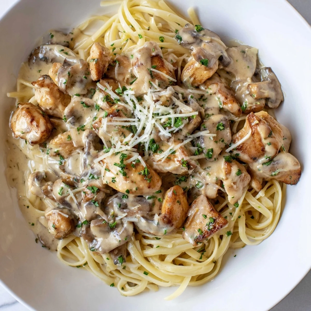 Creamy Mushroom Chicken Pasta: A close-up of the dish, filled with saucy pasta and tender chicken.