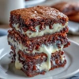Decadent cream cheese stuffed brownie cookies, gooey chocolate centers with creamy vanilla filling.