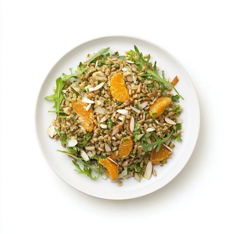 Freshly cooked farro salad with fennel, orange slices, toasted almonds, and arugula tossed in citrus vinaigrette.  