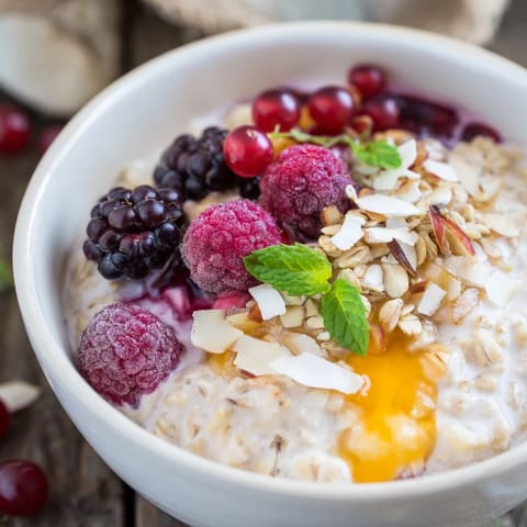 Delicious, colorful Overnight Oats presented in a bowl, featuring vibrant berries and a sweet honey drizzle.