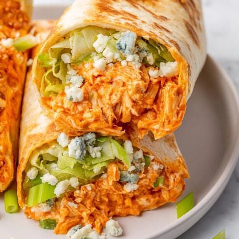 A close-up shot of a savory buffalo chicken dip wrap, perfect for a satisfying, quick lunch.