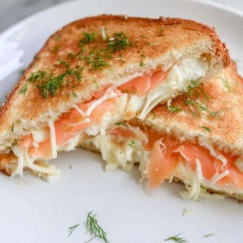 Warm, buttery Smoked Salmon Grilled Cheese sandwich with crispy bread and a rich, creamy interior.
