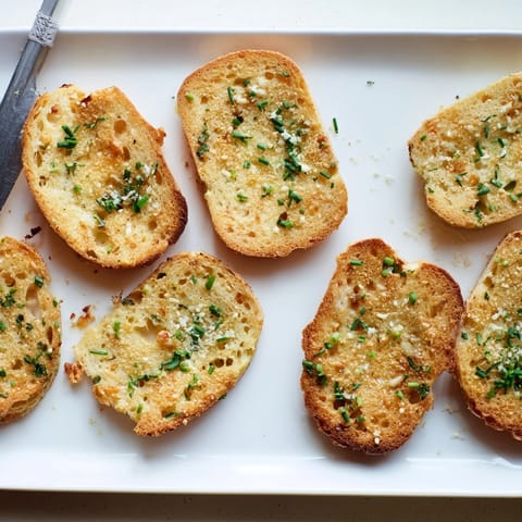 The fluffy, airy texture of this gluten-free cloud bread savory toast is visible, with steam rising from the warm garlic cheese rounds.