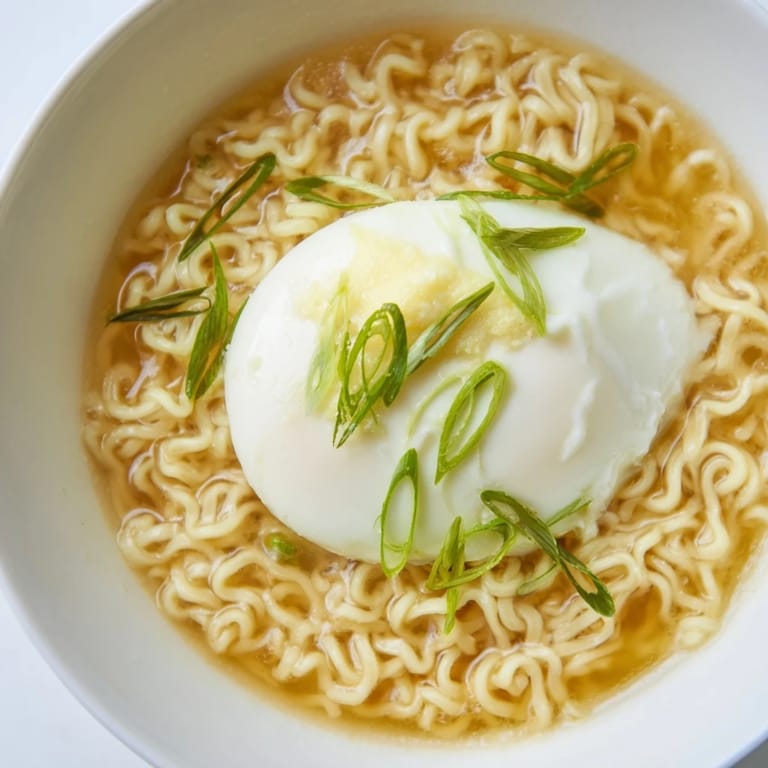 Quick and easy: a close-up of the delicious instant ramen, ready to enjoy with a pat of melted butter.