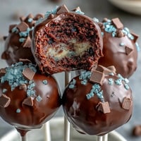 Celebrate graduation with festive cake pops in school colors, decorated with sprinkles and edible glitter.