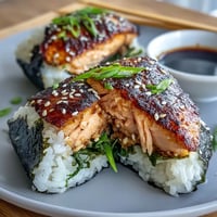 Grilled salmon onigiri filled with savory, flaky salmon and crisped to perfection for a delicious Japanese snack.  